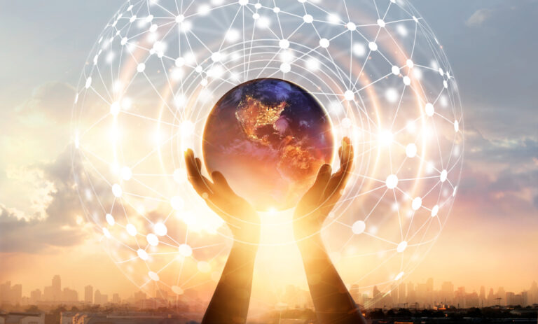 Hands holding a world globe, symbolizing diversity and a globally connected workforce