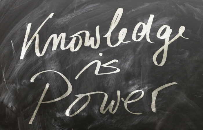 Chalkboard with the phrase ‘Knowledge is power’, symbolizing learning and personal growth