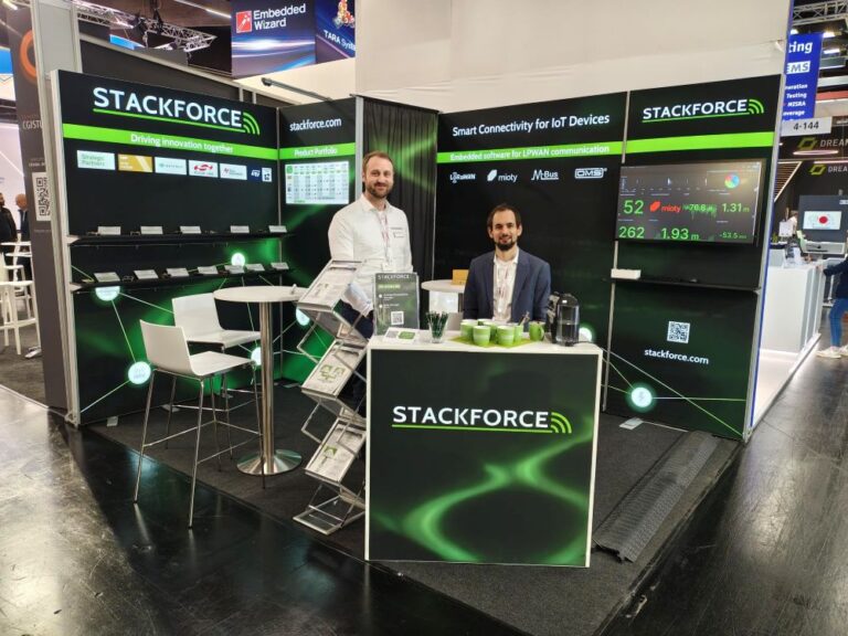STACKFORCE is showing a new booth setup at embedded world 2026 - dark colours and light highlighths