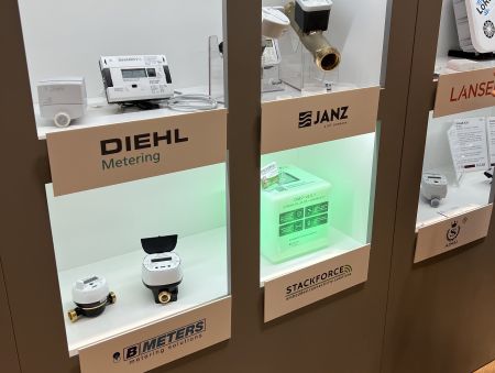 Picture of OMS product wall with STACKFORCE product at Enlit 2025